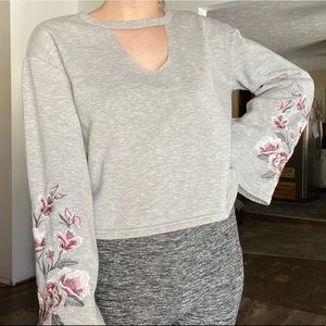 Almost famous embroidered floral sleeves crop top